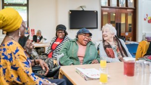 Residents at Randall Close Laugh and joke with one another in the garden